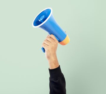 Hand holding megaphone marketing announcement campaign 360x320